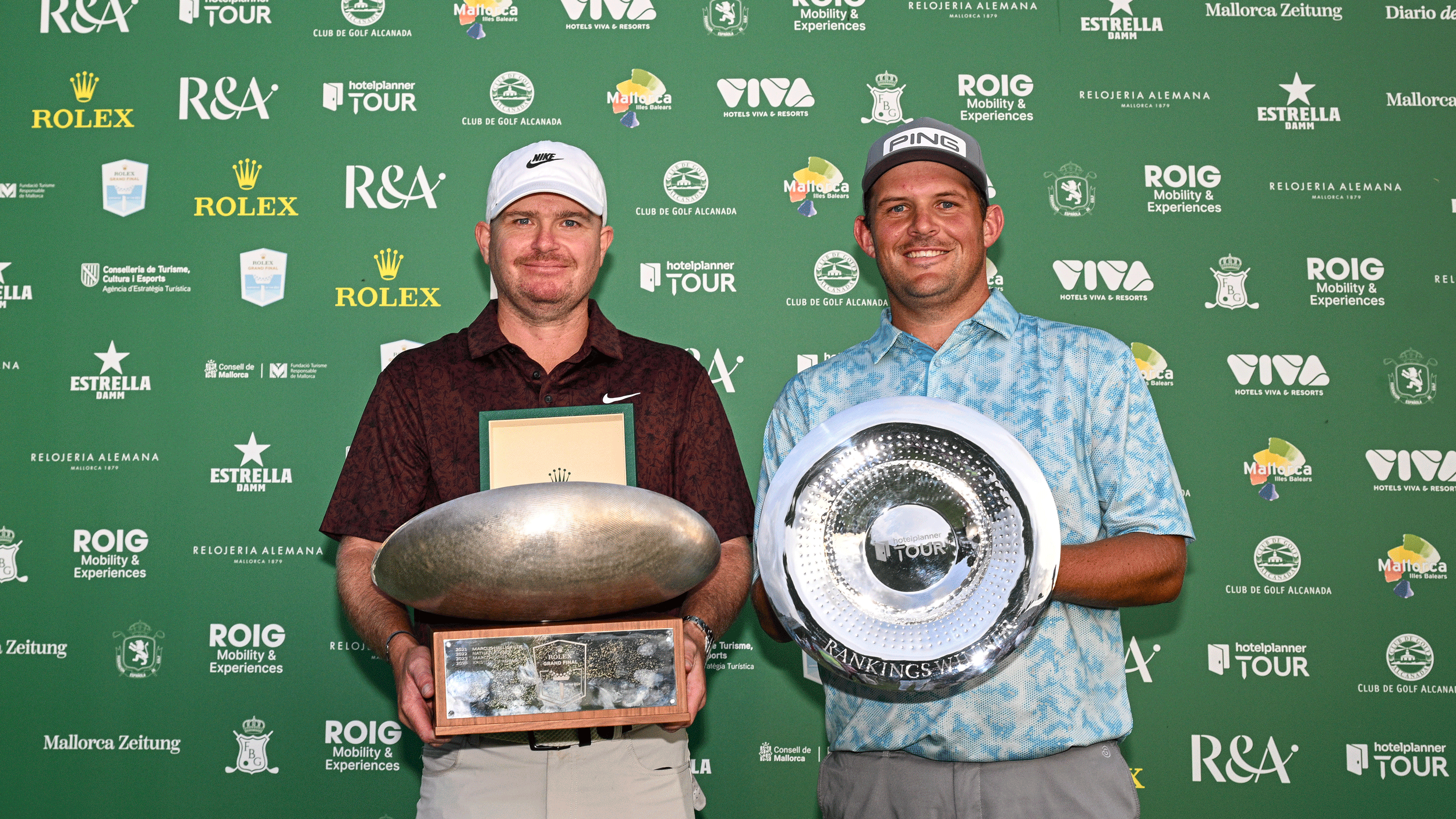 James Morrison (left) poses with the Rolex Grand Final trophy while JC Ritchie (right) poses with the Road To Mallorca trophy