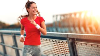 a woman smiling while running