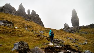 A hiker near Portree on the Isle of Skye