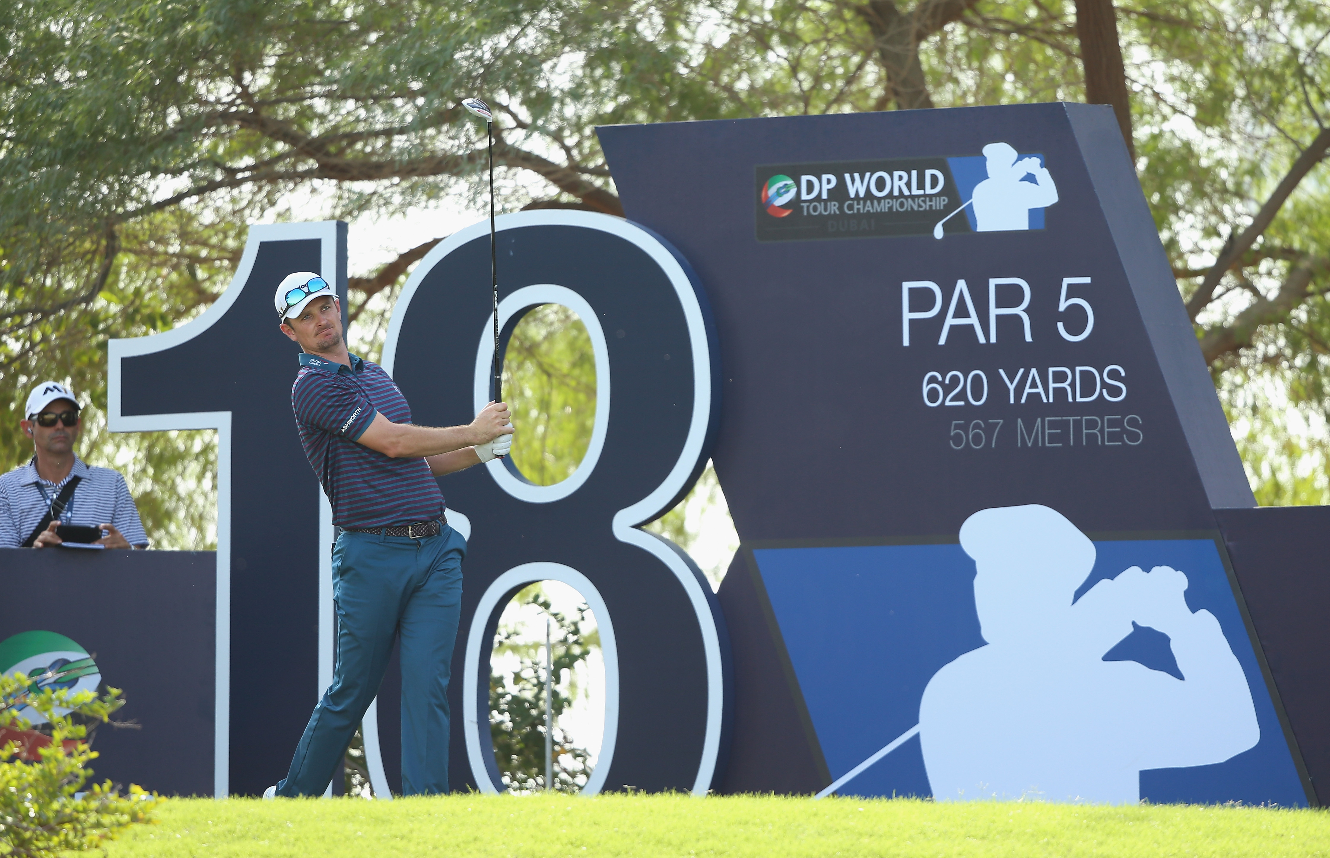 Jason Goldsmith watches his client Justin Rose tee off at the DP World Tour Championship.