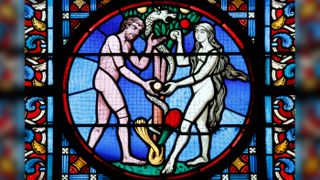 Sacred Heart Basilica stained glass window showing Adam and Eve.