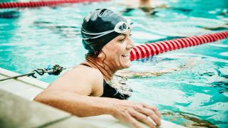 Swimmer at side of pool