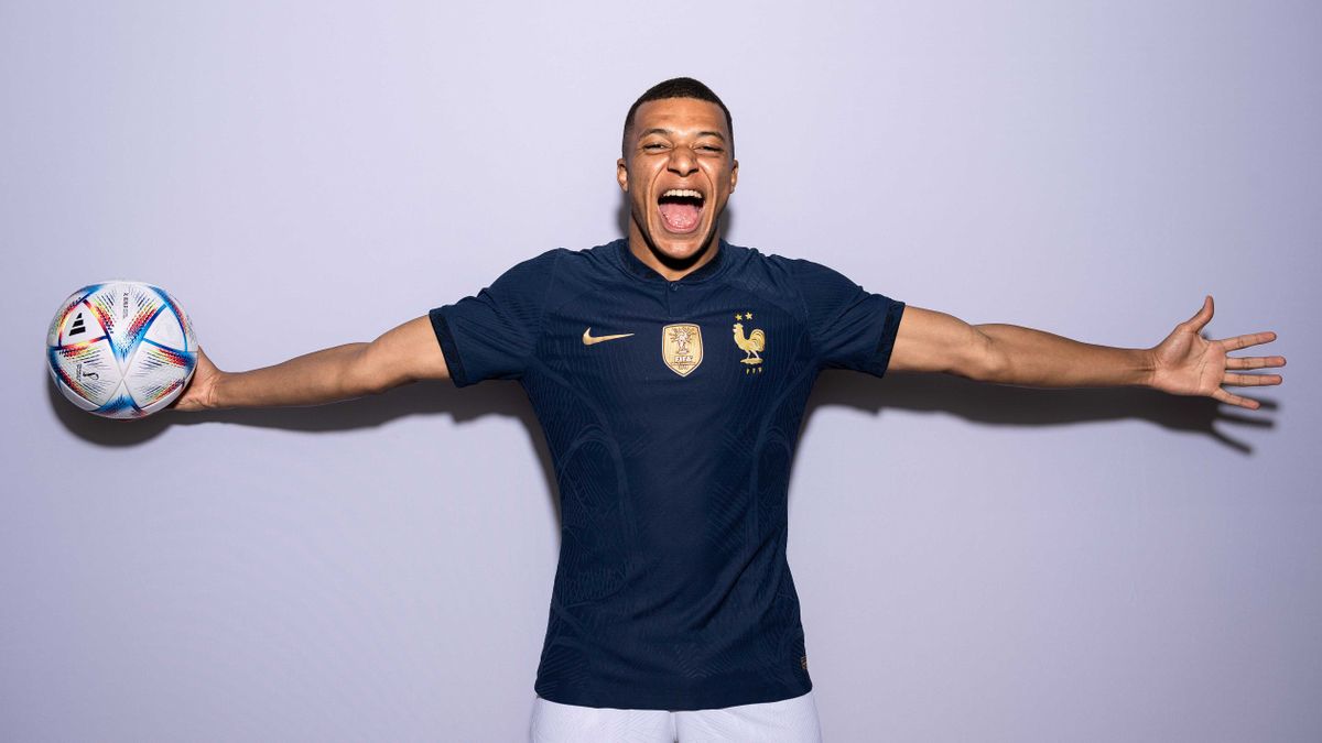 French player Mbappe posing with a football.