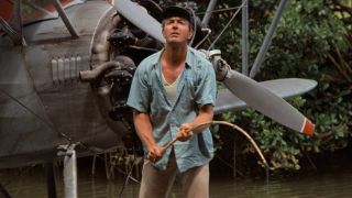 Fred Sorenson looks up while fishing in Raiders of the Lost Ark.