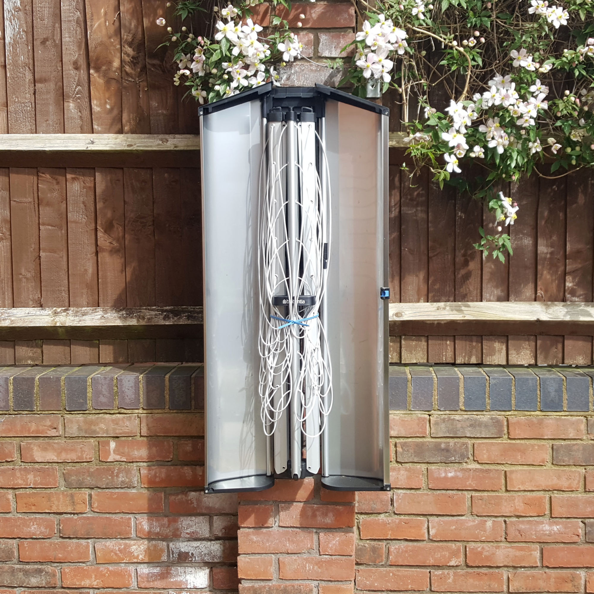 The Brabantia Wallfix Dryer mounted in a small patio