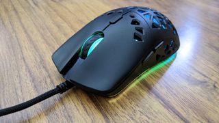 The Marsback Zephyr Pro gaming mouse from the front - the scroll wheel is lit up green