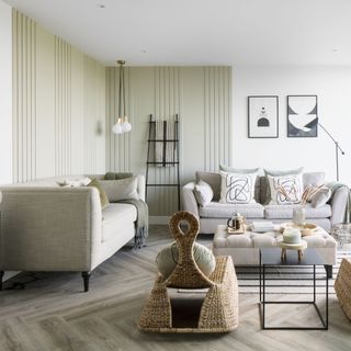 TV room with a neutral colour scheme wicker rocking chairs and pale coloured sofas