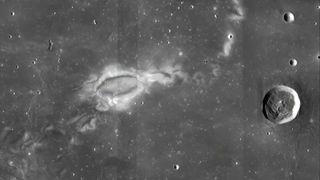 A mosaic of Lunar Reconnaissance Orbiter Camera (LROC) images showing the lunar swirl Reiner Gamma. The “eye” of the swirl can be seen in the center left, while other bright markings of the swirl extend to the lower left and upper right of the image. 