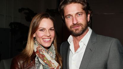 Actors Hilary Swank (L) and Gerard Butler attend the 2011 Film Independent Spirit Awards Voter Party at Santa Monica Place on February 26, 2011 in Santa Monica, California.