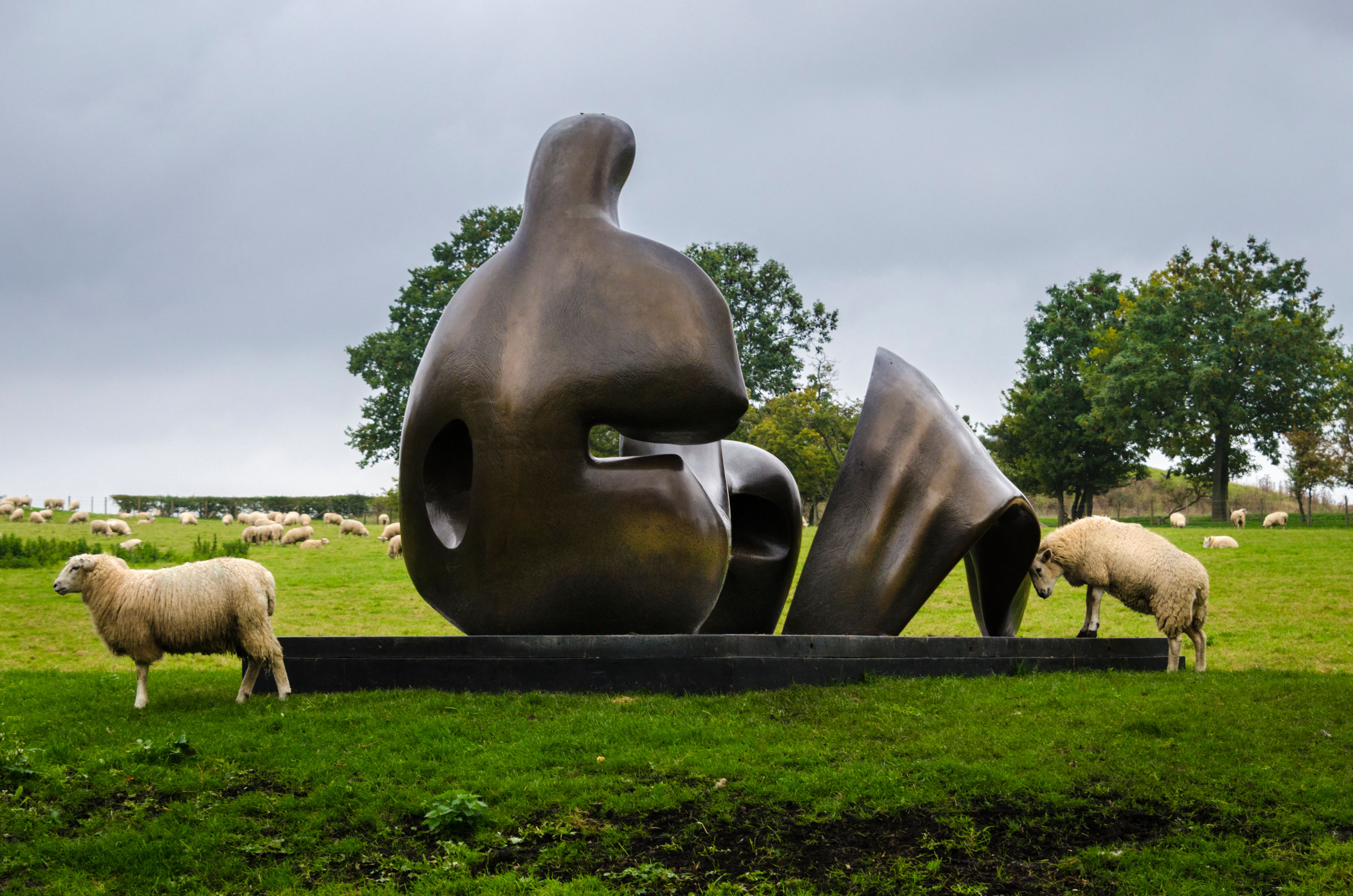 Henry Moore Foundation bronze sculpture Three Piece Reclining Figure Draped in a sheep field. Perry Green Much Hadham Hertfordshires