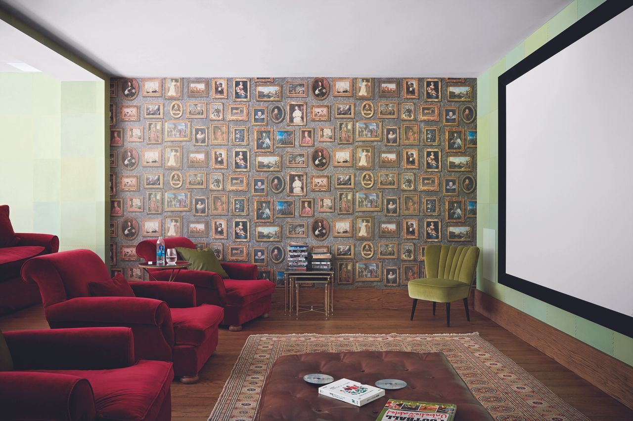 media room ideas with large cinema screen and red armchairs