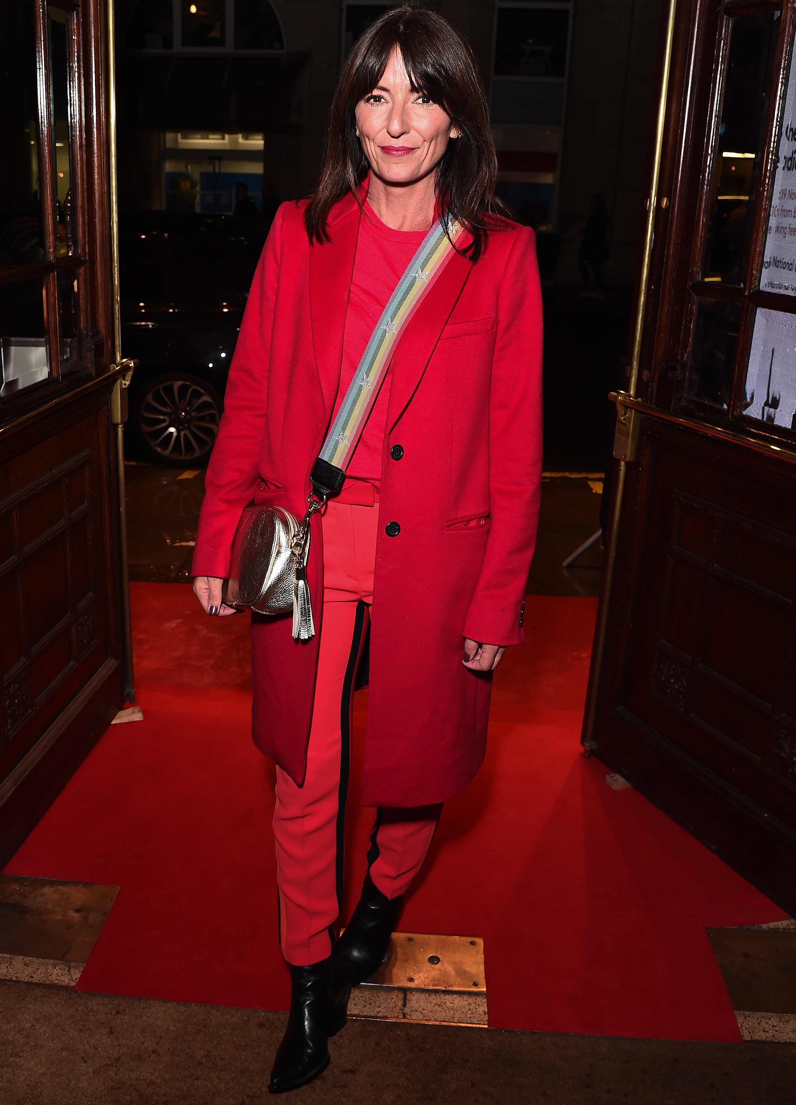Davina McCall wearing red suit