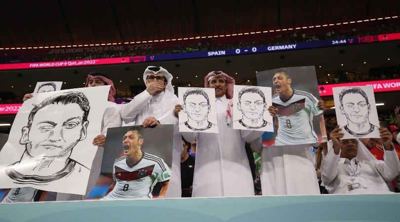 Qatari fans hold up images of Mesut Ozil during Germany&#039;s World Cup clash against Spain in response to the Germans&#039; recent protest ahead of the match with Japan at the 2022 World Cup.