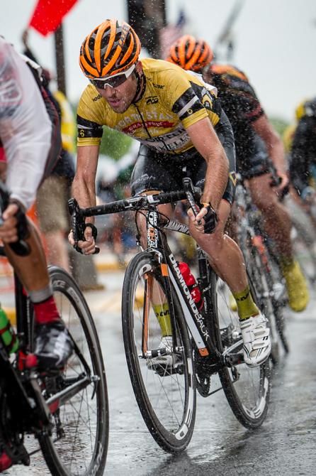Ryan Anderson (Optum) is covered by spray as he enters the wet finish circuits