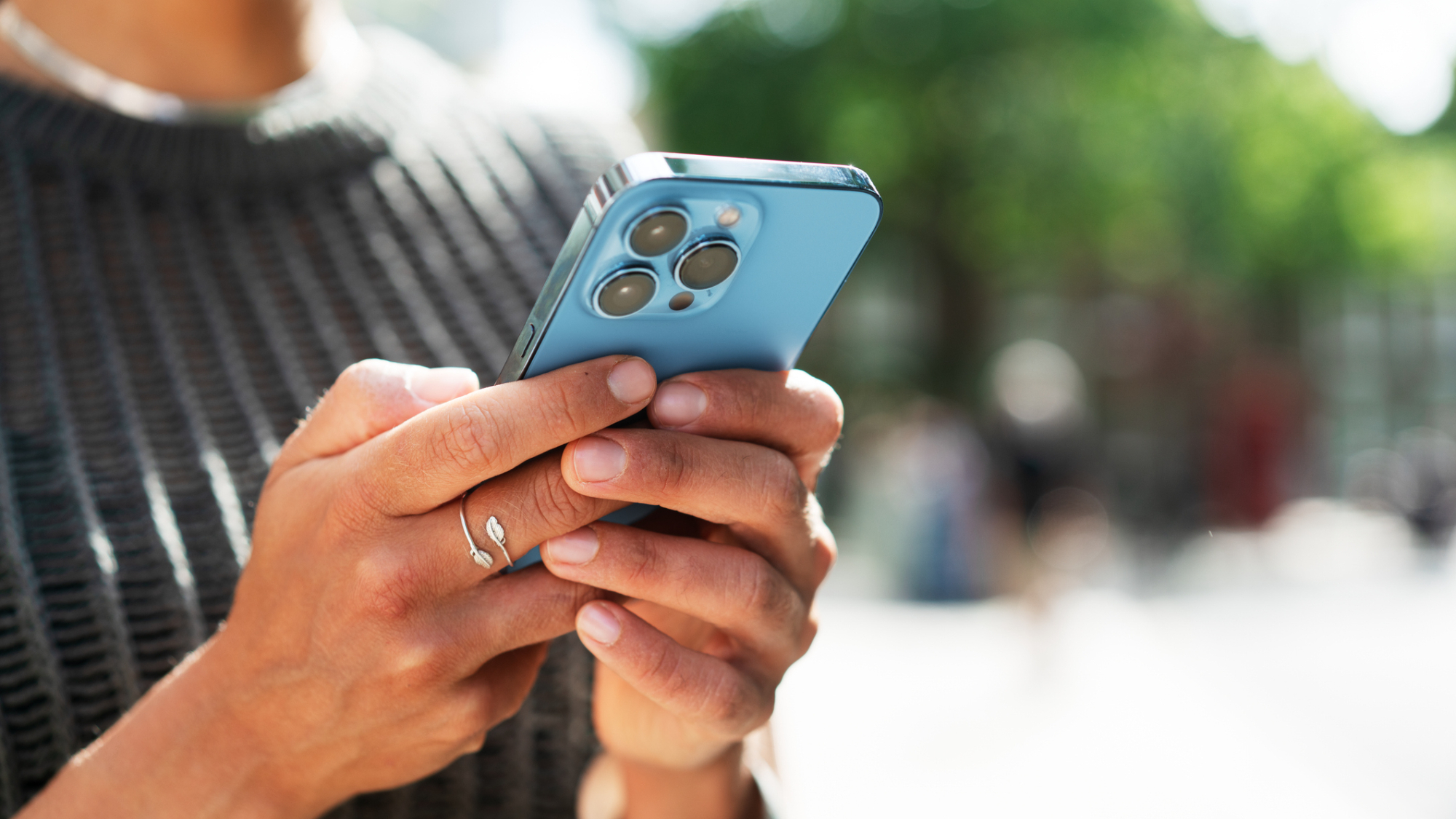 A person holding an iPhone