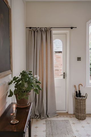 hallway with door curtain and side table