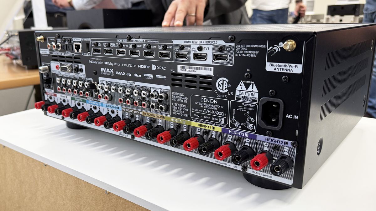 The Denon AVR-X3900H's rear panel, showing a very large array of connections in and out