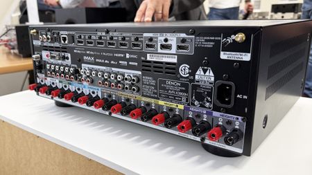 The Denon AVR-X3900H's rear panel, showing a very large array of connections in and out