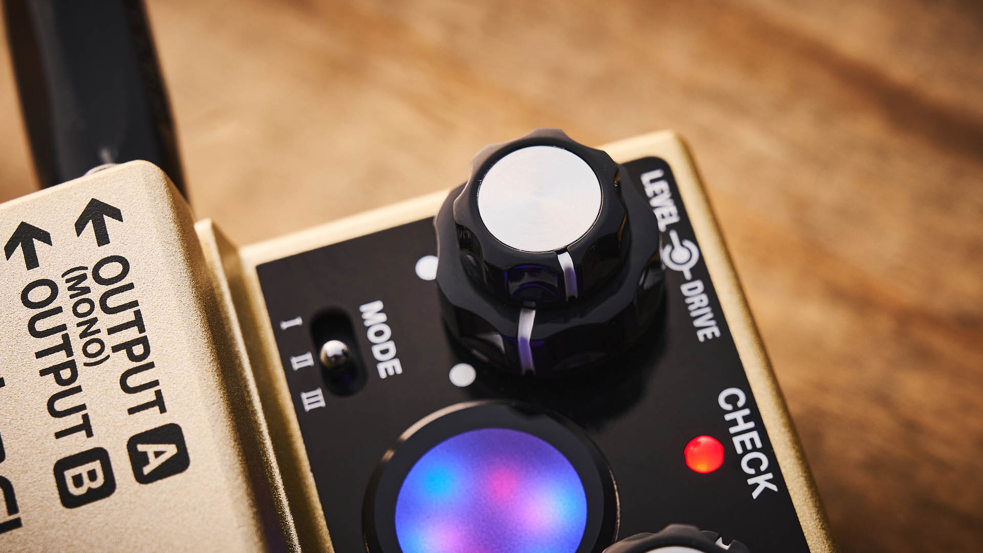 The Boss RT-2 Rotary Ensemble pictured in close-up against a wooden floor.