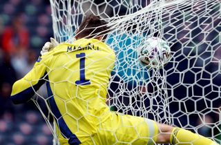 Scotland goalkeeper David Marshall crashes into the back of the net after conceding the second goal scored by Czech Republic’s Patrik Schick