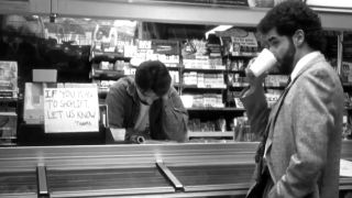 the interior of the Quick Stop Groceries in Clerks with a man drinking coffee