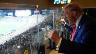 President Donald Trump attends a game between the NFL Pittsburgh Steelers and the New York Jets