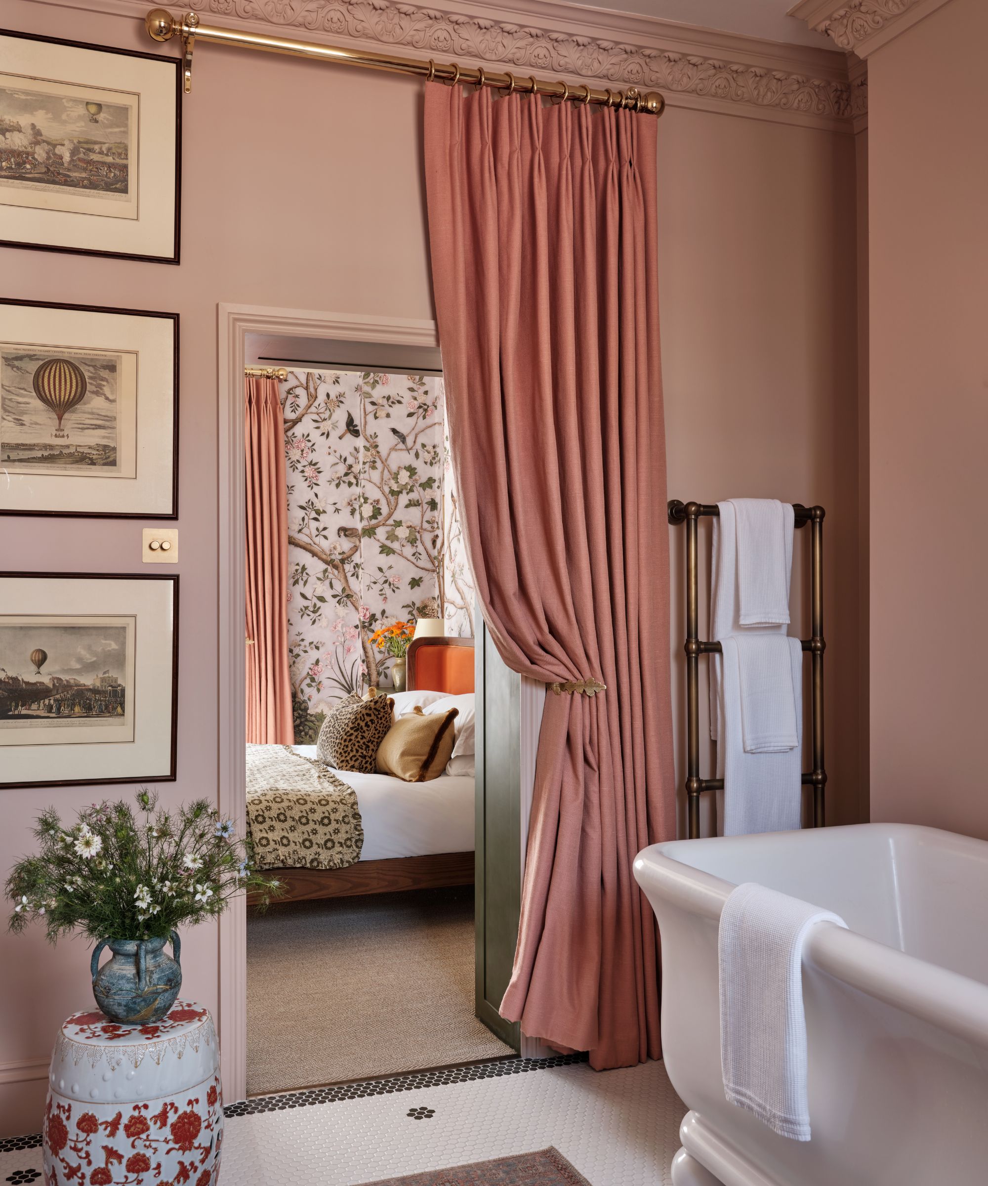 A primary suite with a pink bathroom