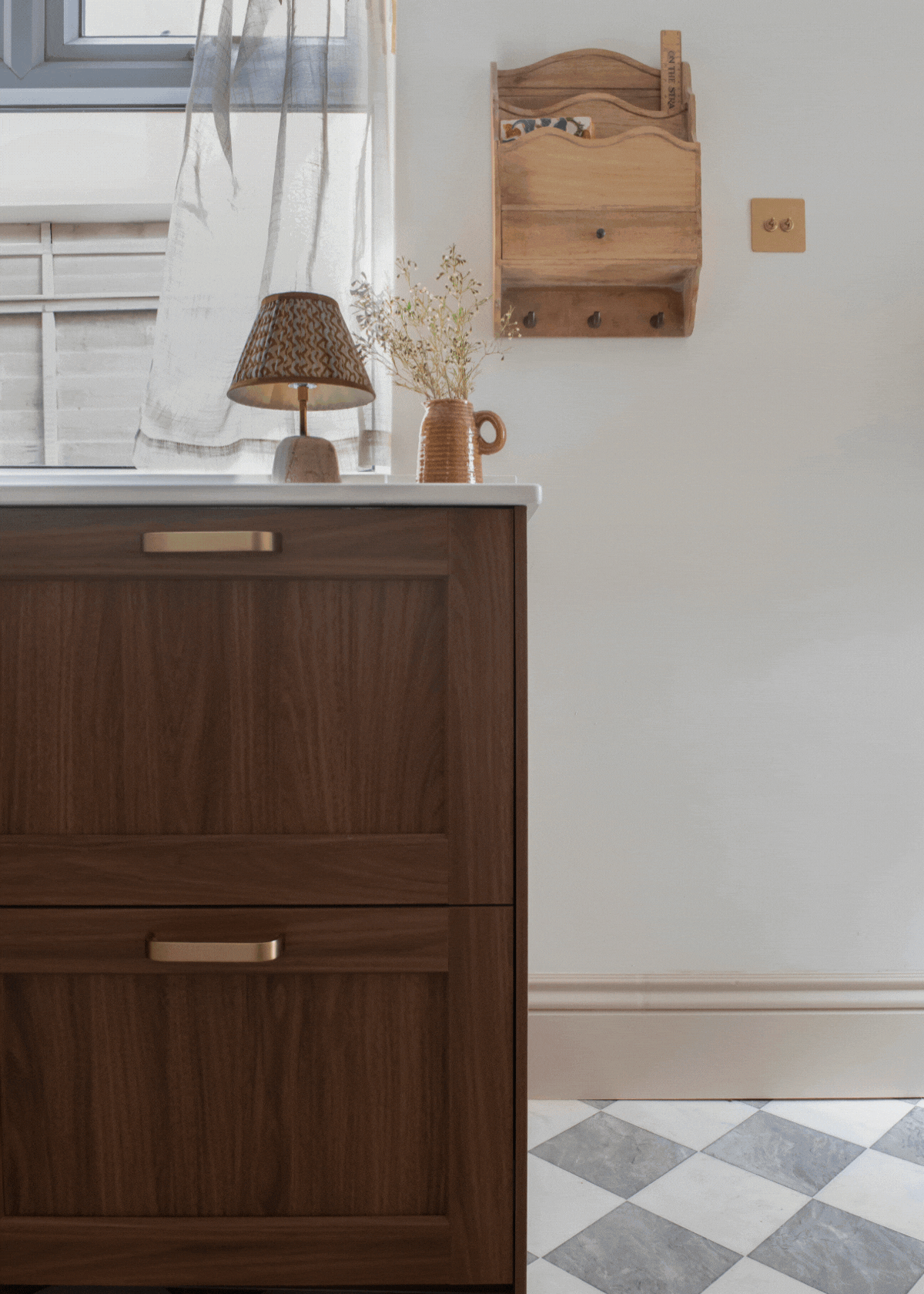 A gift of a modern kitchen with dark wood cabinets and monochrome flooring. Each shot is a different angle of the kitchen.