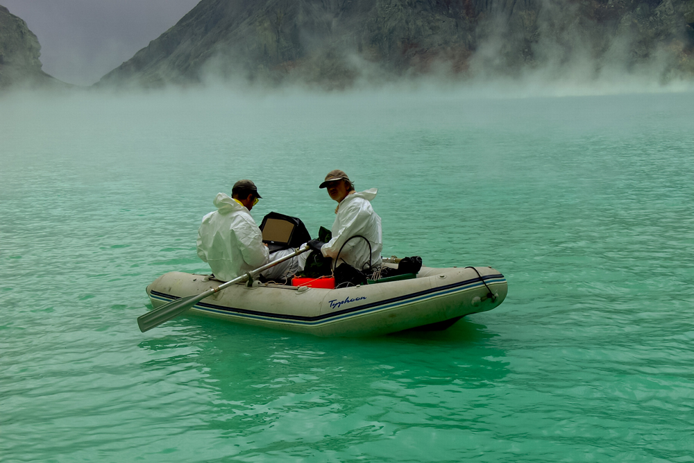 Corentin Caudron and a colleague collect depth measurements at Ijen Crater Lake.