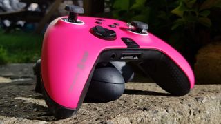 Scuf Instinct Pro controller on a stone step