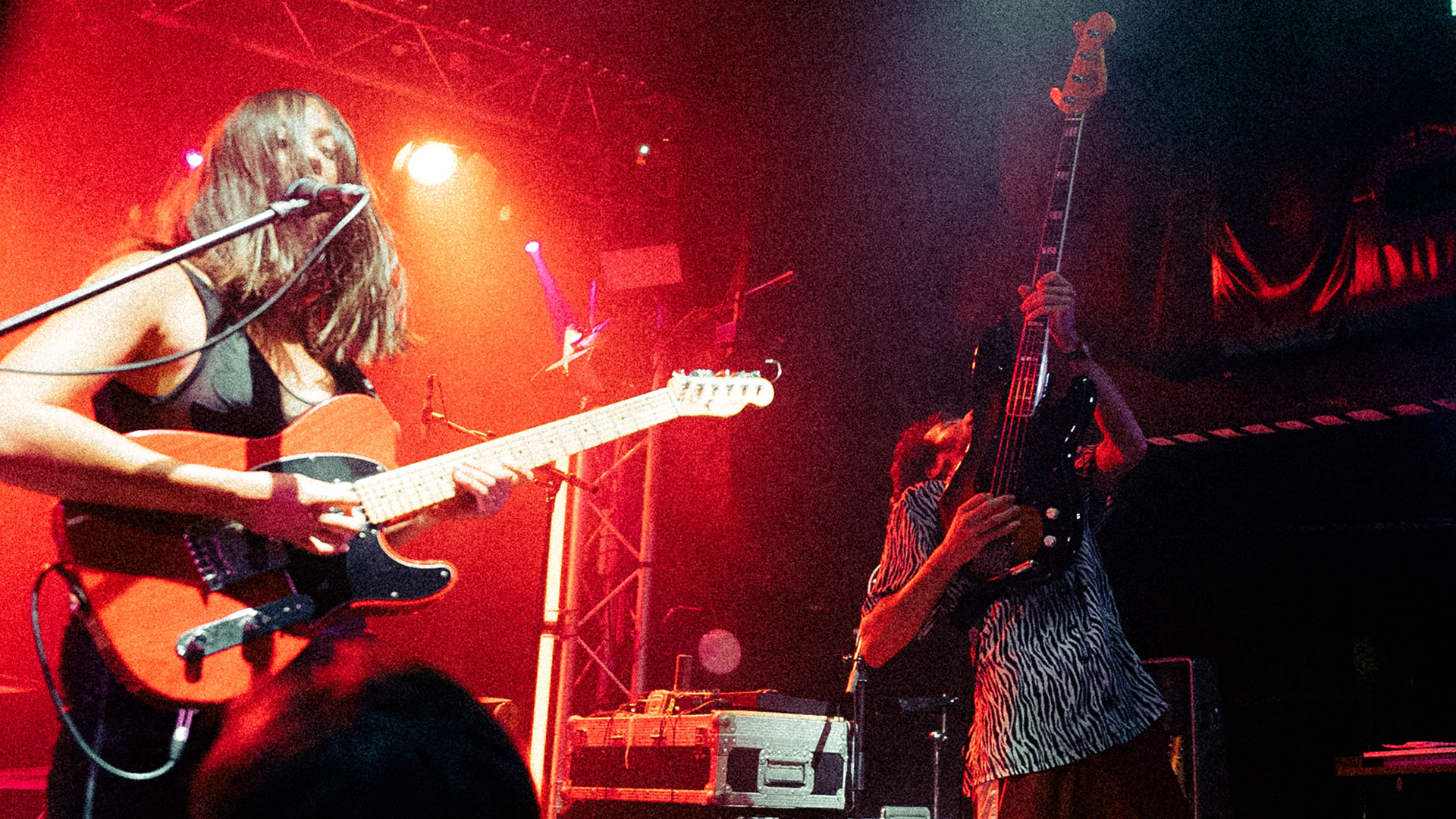 Tina Maynard (left) of UK rock band Masca plays her red Fender Telecaster onstage