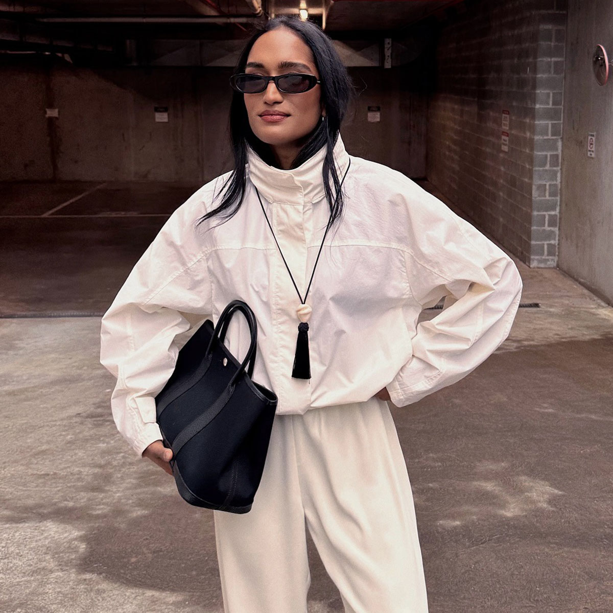 woman in white funnel-neck sporty jacket