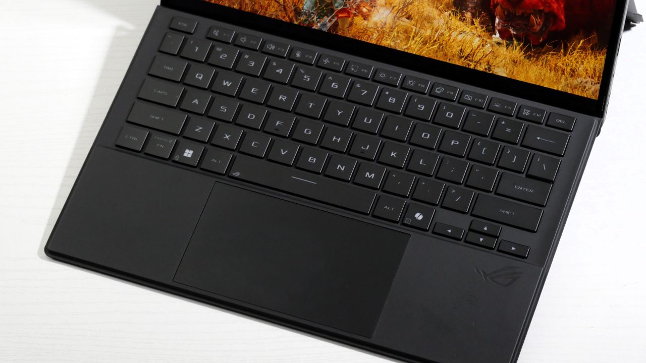 Asus ROG Flow Z13 (2025) on a white table, highlighting the black keyboard.
