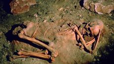 The burial of a 25-30 year old woman from St. Germain-le-Ridiere, France. The skull has red ochre markings, suggesting a ritual burial. 