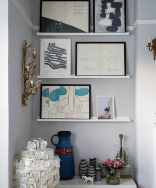 Grey alcove filled with artwork