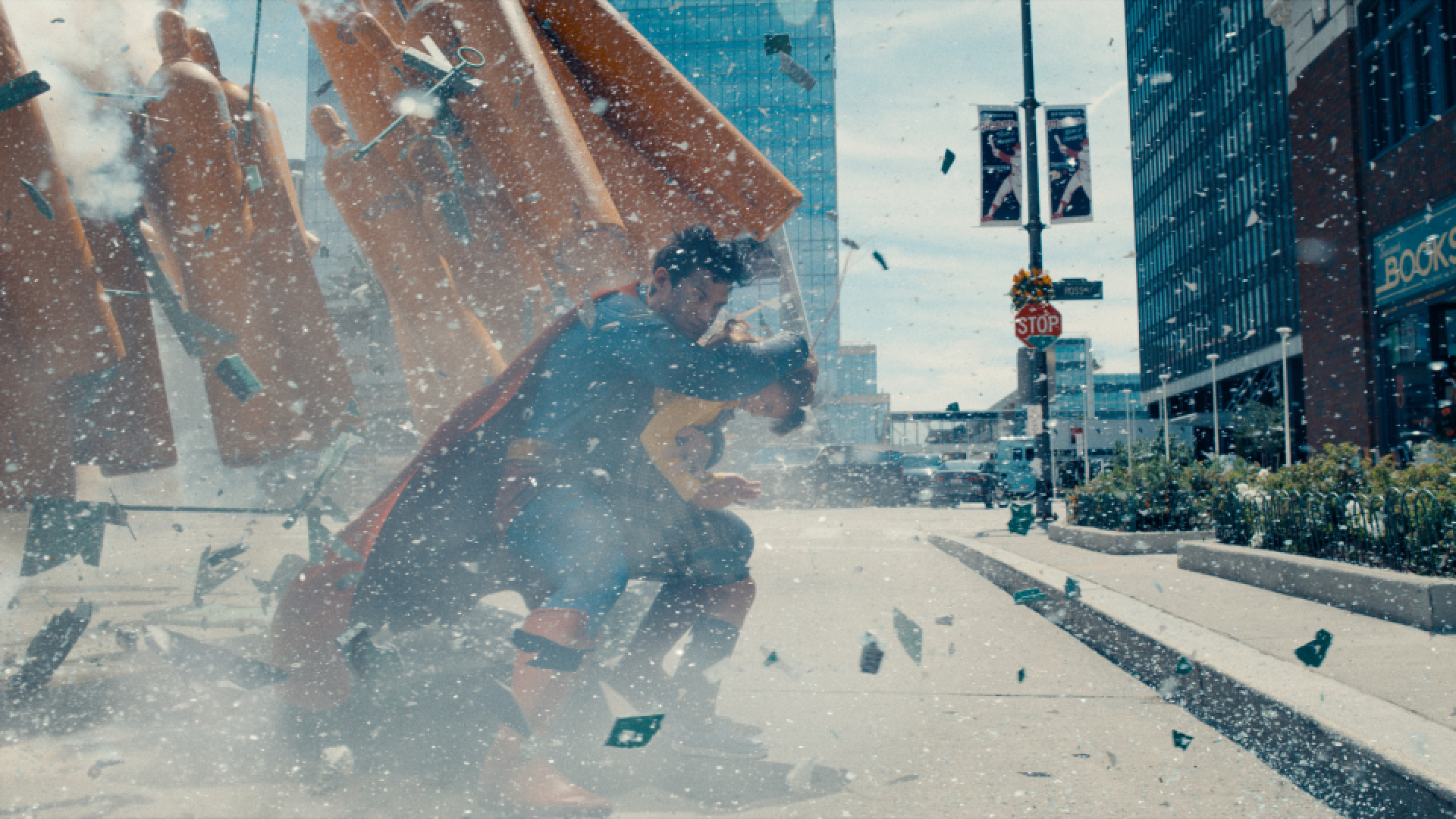 David Corenswet as Superman saving a citizen
