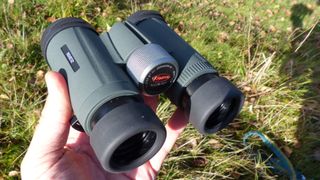 Kowa BD32-8XD binoculars in person's hand