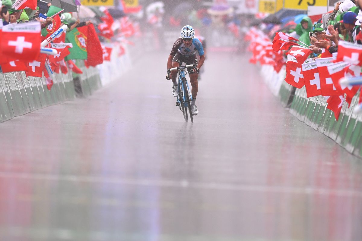 Domenico Pozzovivo (AG2R La Mondiale) sprinting through the rain to the win