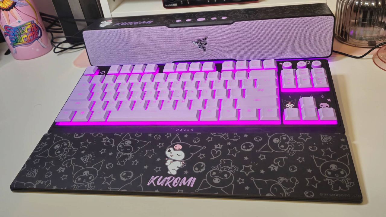 Photos taken by writer Rosalie Newcombe of the Razer Ornata V3 Tenkeyless Kuromi Edition gaming keyboard, on a white desk.