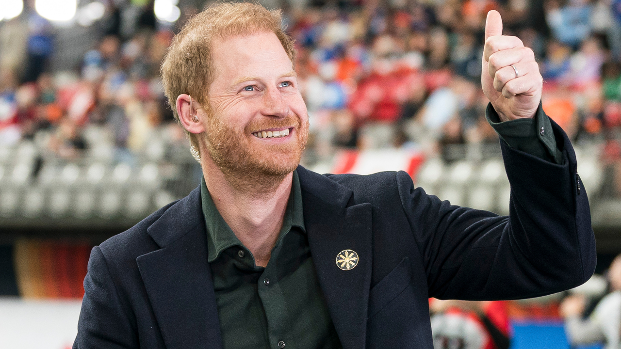 Prince Harry acknowledges fans prior to the start of a TV interview during pre-game festivities before the start of the 2024 Grey Cup at BC Place on November 17, 2024 in Vancouver, Canada.