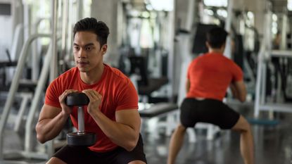 Man performing a dumbbell workout