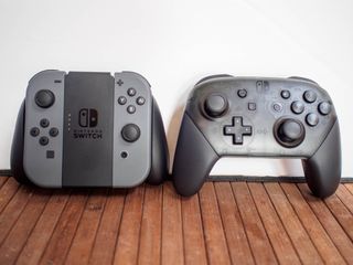 Joy-Con controllers next to Pro Controllers