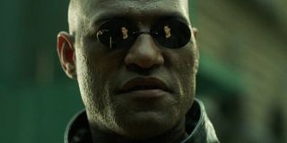The Matrix's Neo's (Keanu Reeves) reflection is visible in Morpheus' (Laurence Fishburne) sunglasses.