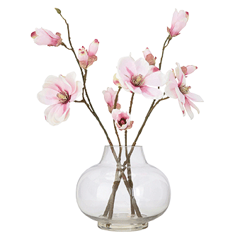 faux magnolia in glass vase