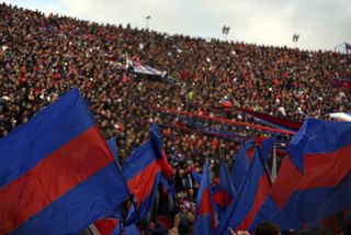 San Lorenzo fans cheer on their team in a game against Rosario Central in October 2015.