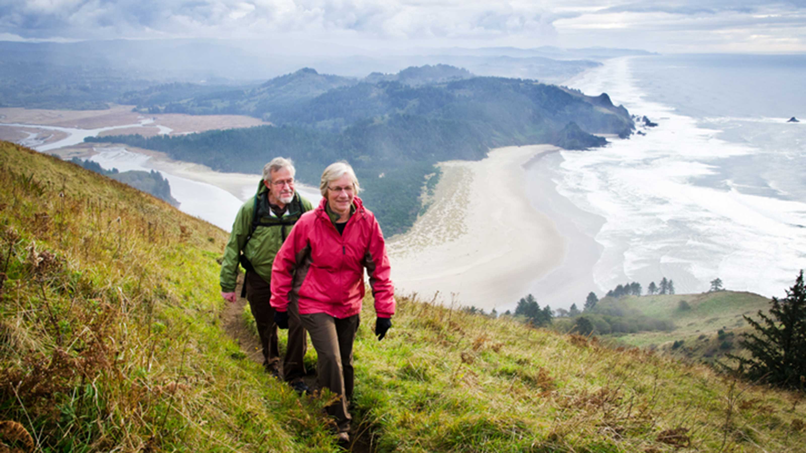 Senior couple hiking in the hills above the Oregon coastline