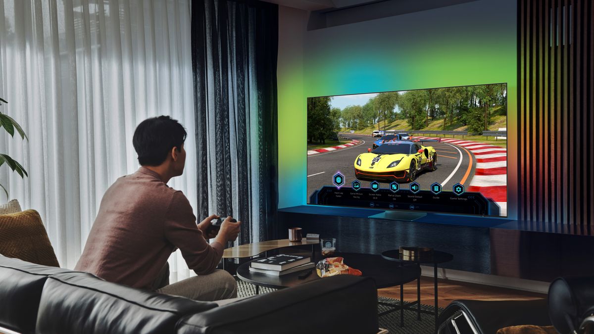 Man playing a Racing game on a Samsung OLED TV