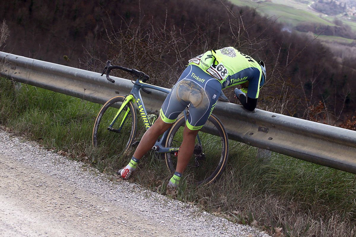 Nikolay Trusov (Tinkoff) picks himself up after a crash
