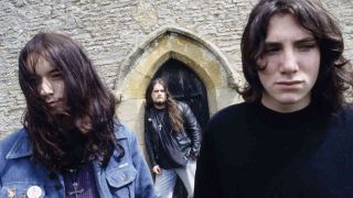 Electric Wizard standing outside a stone church