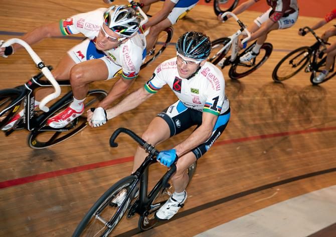 Kenny de Ketele and Luke Roberts make an exchange during a Madison.